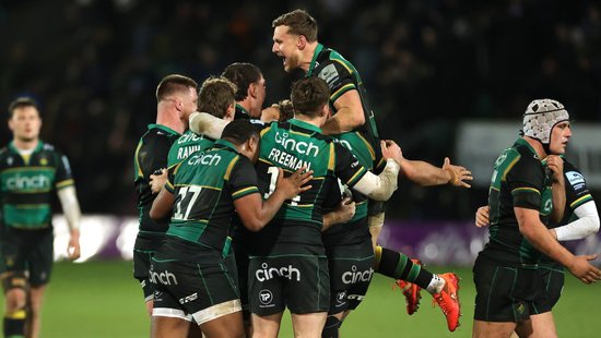 Northampton Saints celebrate a bonus-point win over Bath Rugby.